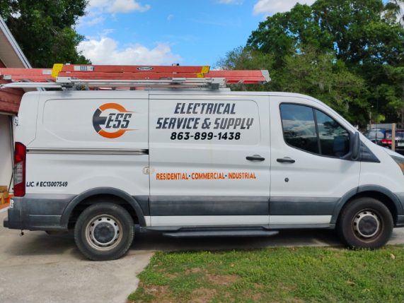 White service van with ESS Electrical Service & Supply branding, ladder on the roof, and a phone number on the side.